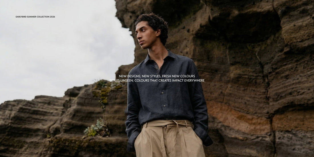 indian man wearing pure linen shirt by tyra linen in a scenic background, navy blue linen shirt and beige tailored trousers