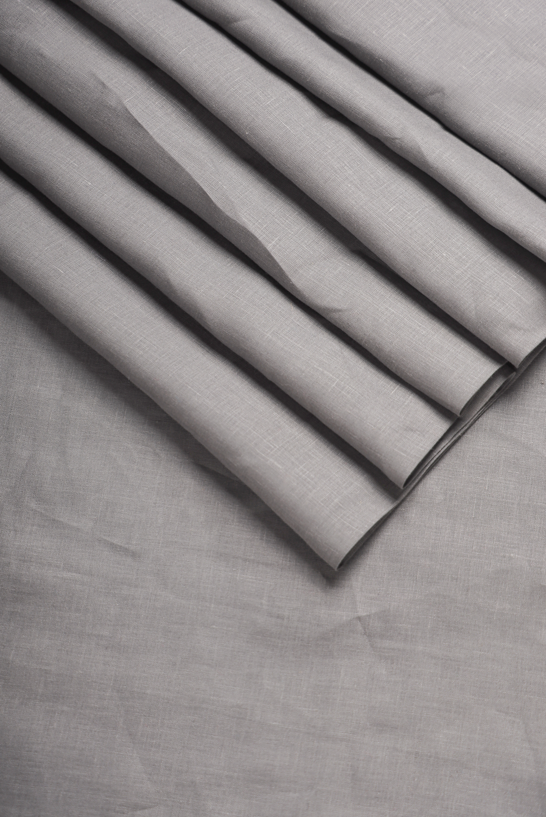 Natural linen shirt fabric texture showing cooling weave suitable for hot weather