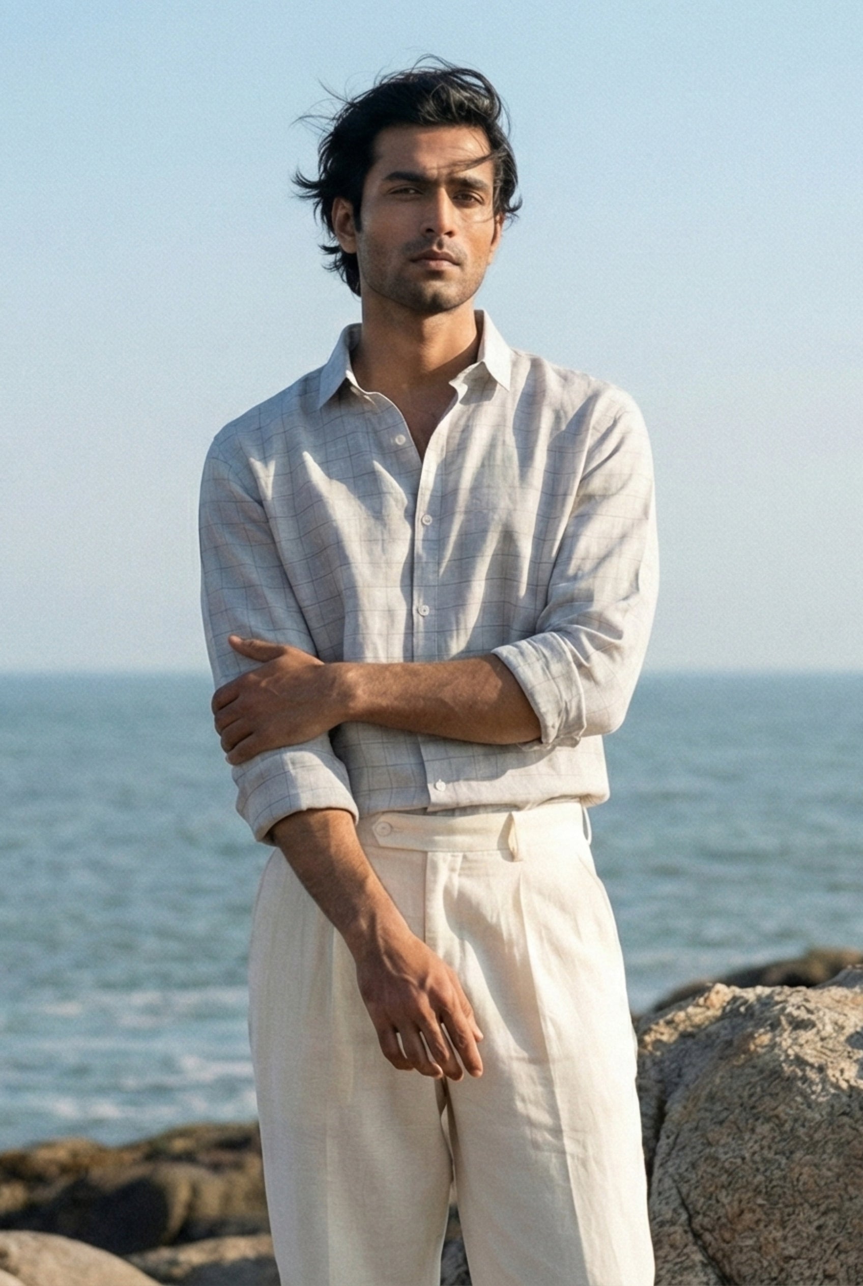 Premium light grey linen check shirt for men paired with off-white trousers, showcasing breathable summer menswear with a refined, modern silhouette.
