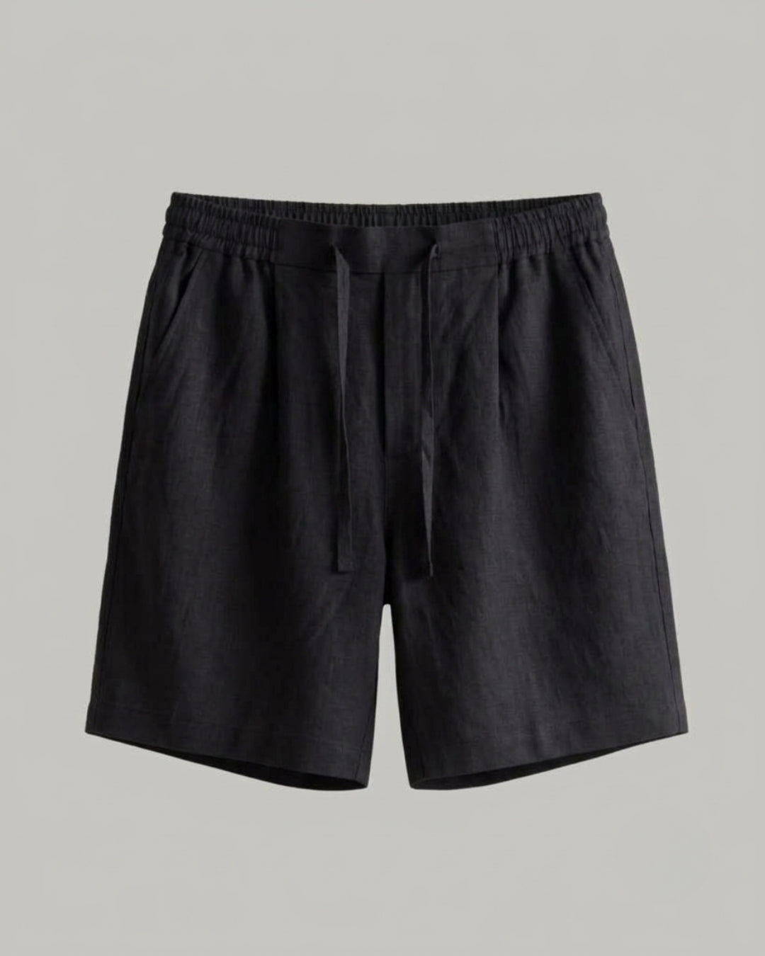  Black linen shorts with an elasticated waistband, adjustable drawstring, side pockets, and a relaxed straight fit.