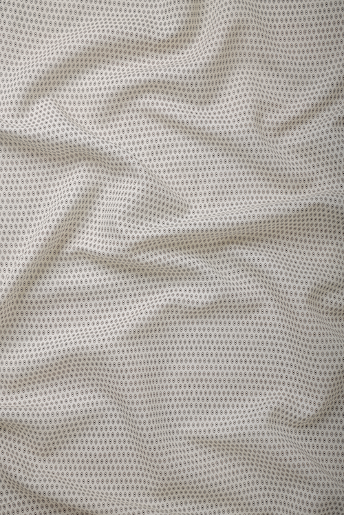 White linen fabric with a micro geometric print, featuring crisp pattern definition, lightweight construction, and a smooth breathable surface